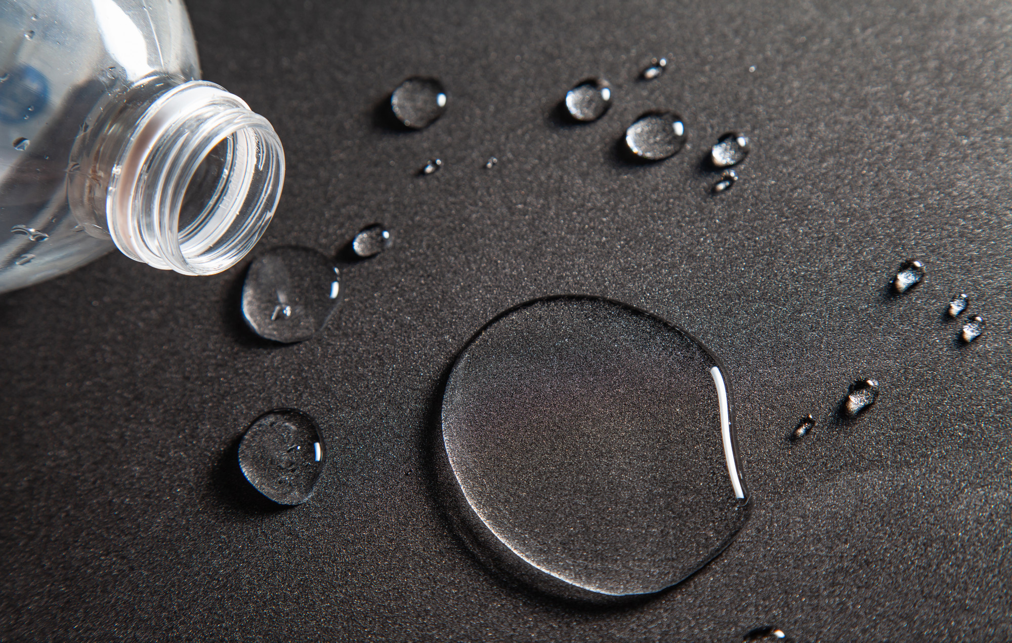 Drops of water on the floor From the liquid in the bottle plastic.