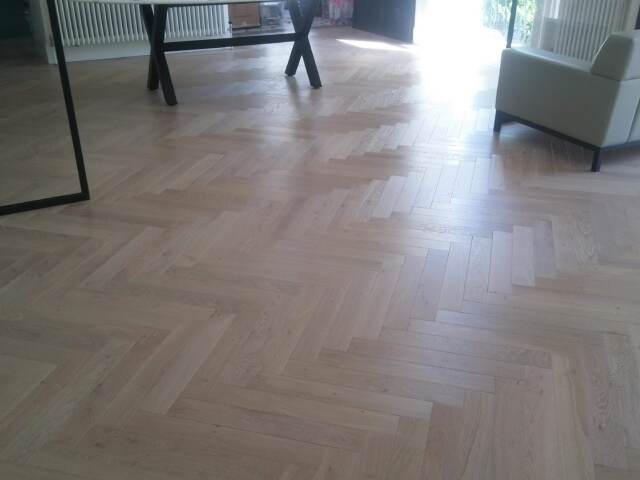 Panaget Herringbone Oil Tufeau Installation In Canary Wharf