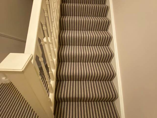 Hugh Mackay Carpets Deco Stripe Woodland installation in Earls Court