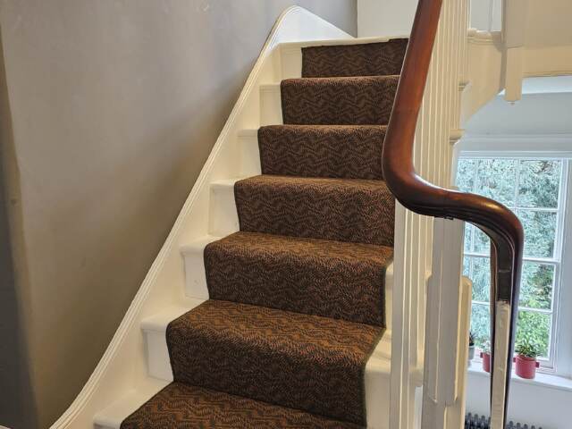 Crucial Trading Enigma Eternal Flame carpet installation in Camden