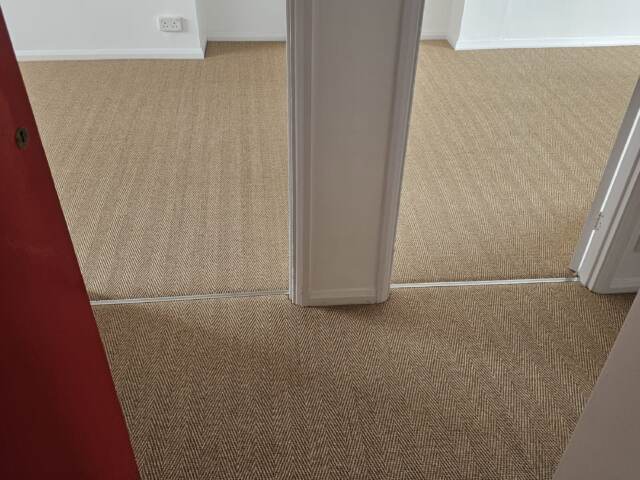 Kersaint Cobb Sisal Herringbone Copper carpet installation in Battersea