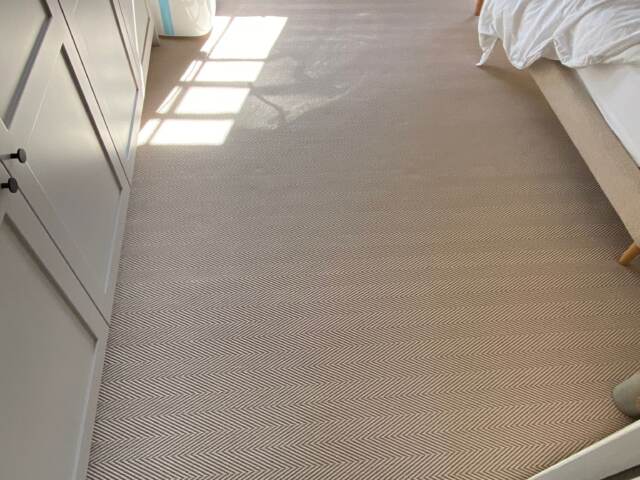 Fibre Carpets Re-Vive Wool-Look Chevron Teak carpet fitting in Canary Wharf